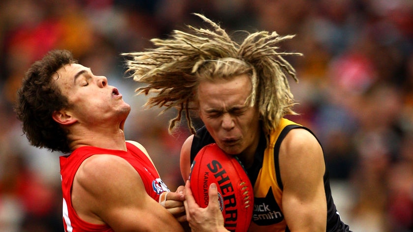 Hard-fought win: Richmond's Ben Nason (r) and Swan Mike Pyke tussle for possession.