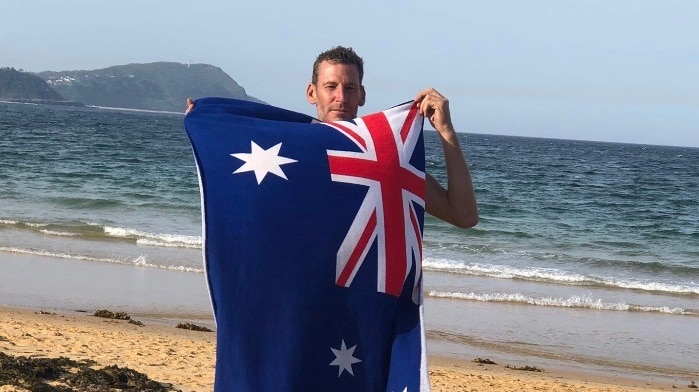 Man holding an Australian flag