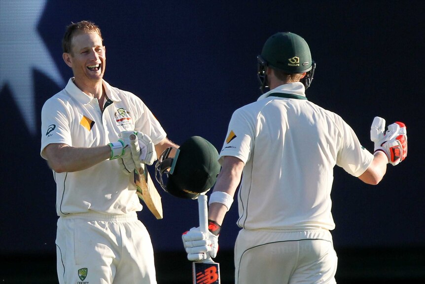 Australia's Adam Voges celebrates his century with Steve Smith on day four at the WACA.