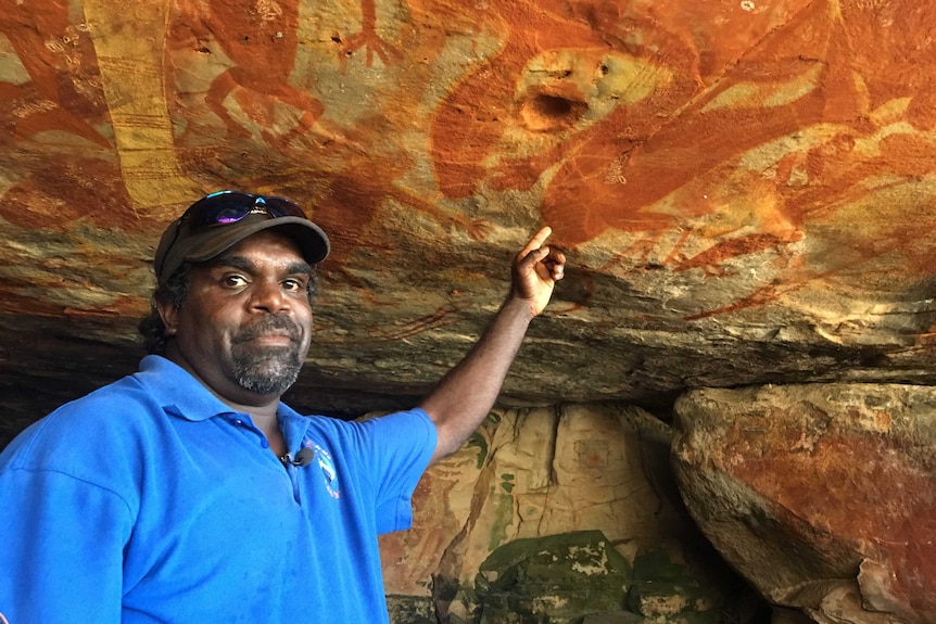 Brendan Yantarrnga shows some rock art on Groote Eylandt