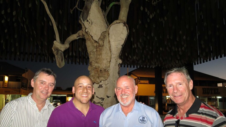 Sean McCarthy, Kevin Hines, John Brady and Kevin Briggs under the Tree of Knowledge in Barcaldine.