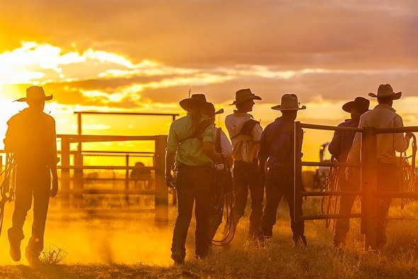 Kennis Campbell, Georgie Whatmore, Ed Ross, Ian Campbell, Aaron Land and Harry Buckley walk into the yards as the sun sets.