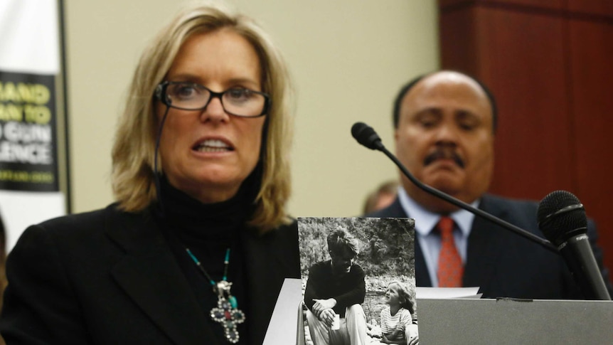 Kerry Kennedy speaks at a podium, in front of Martin Luther King III