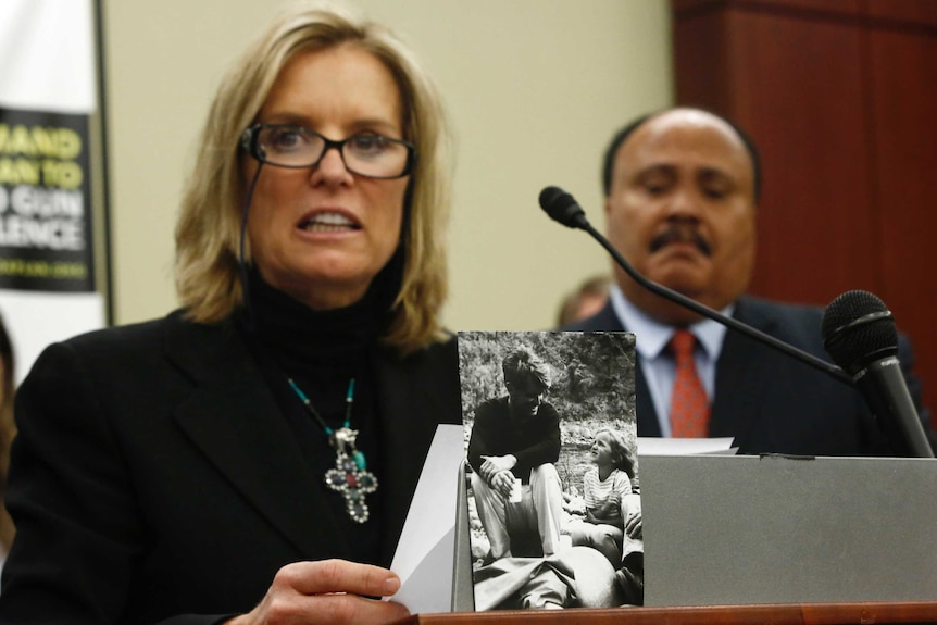 Kerry Kennedy speaks at a podium, in front of Martin Luther King III