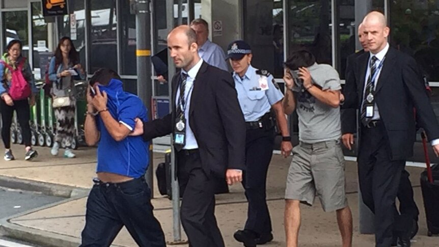 Two of three alleged Chilean bag snatchers arrive on Gold Coast to face court