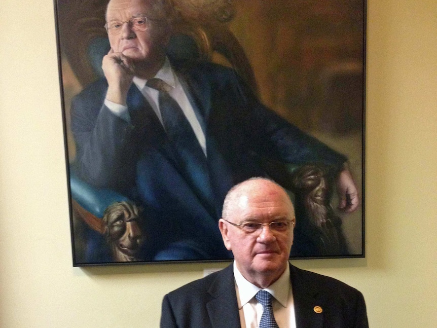 Former Tasmanian Speaker Michael Polley with his official portrait.