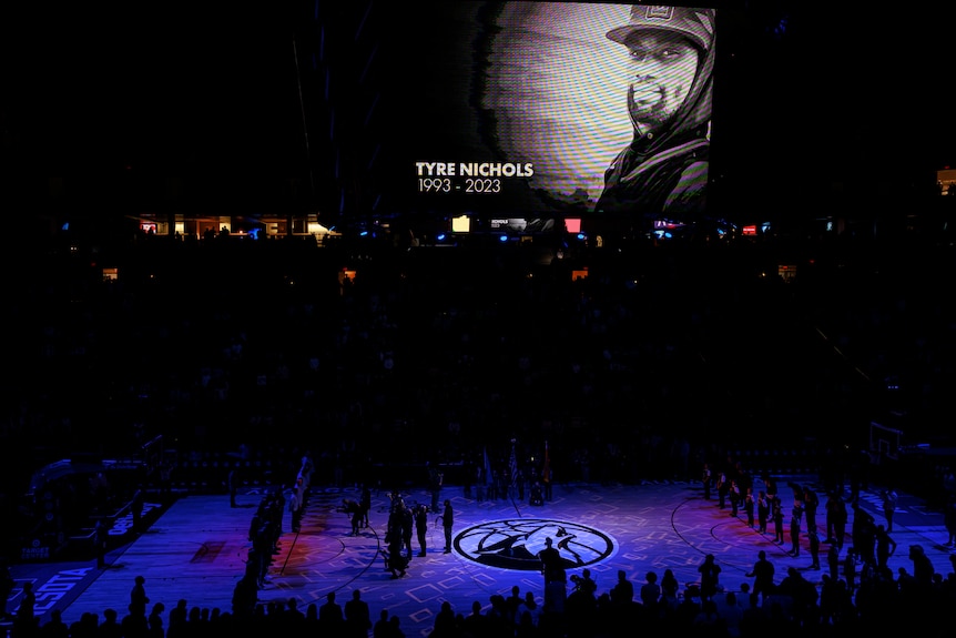 Tyre Nichols picture is seen on the large screen before an NBA game.