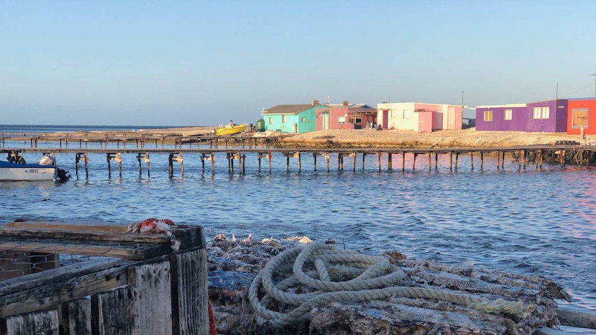 Colourful fishing shacks, jetties on Basile island.