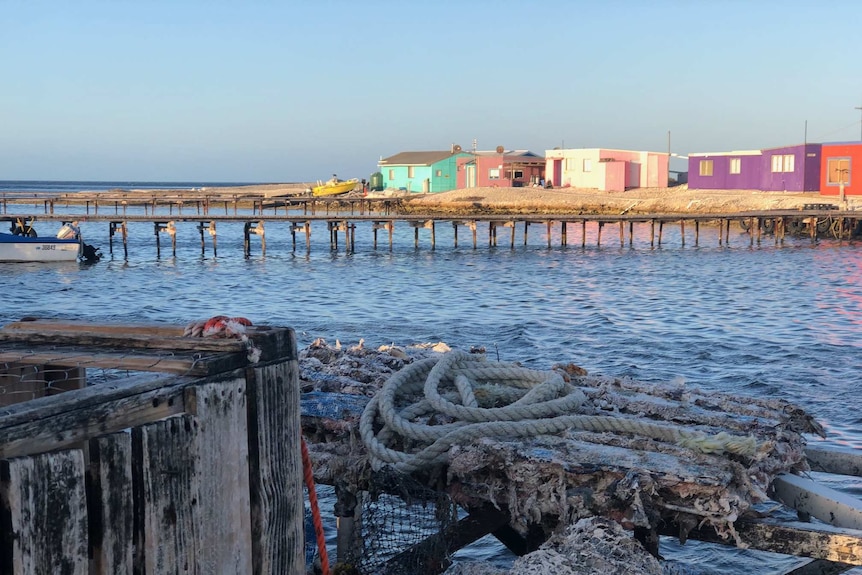 Colourful fishing shacks, jetties on Basile island.