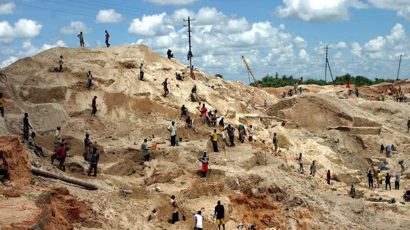 Artisanal miners dig in an open-pit mine in the Democratic Republic of Congo