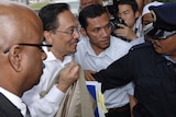 Malaysia's de facto opposition leader Anwar Ibrahim is led by police
