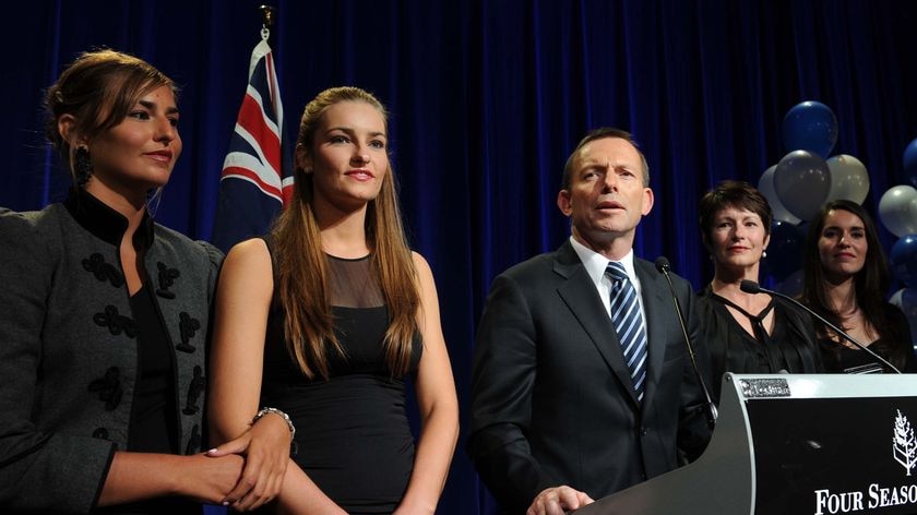 Tony Abbott, flanked by family, addresses supporters at the Liberals' election function