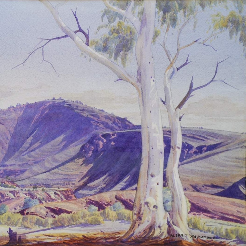 A watercolour painting of a mountain and gum tree in Central Australia.