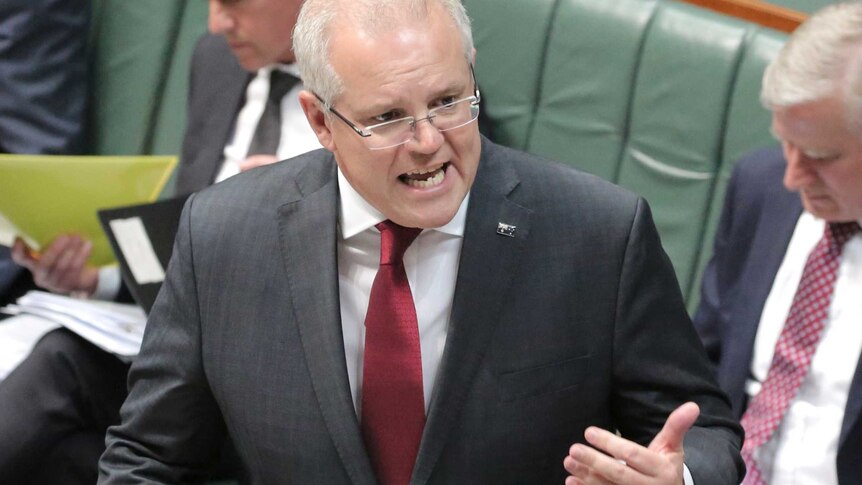 Morrison gestures as he speaks in parliament