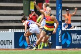Adelaide's Erin Phillips gestures after kicking a goal against the Bulldogs in AFLW