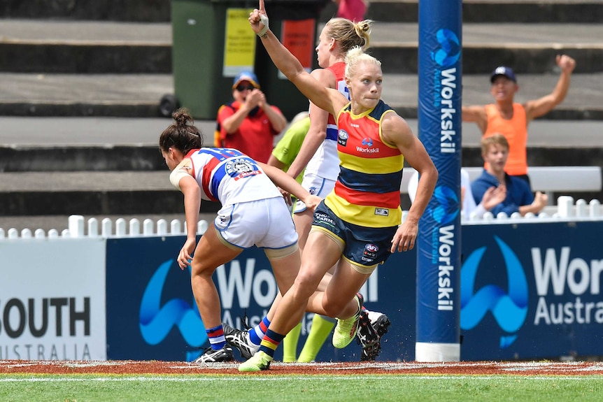 Adelaide's Erin Phillips gestures after kicking a goal against the Bulldogs in AFLW