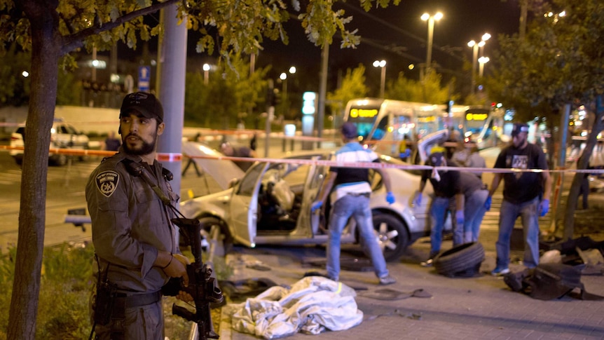 Israeli policeman stands guard.jpg