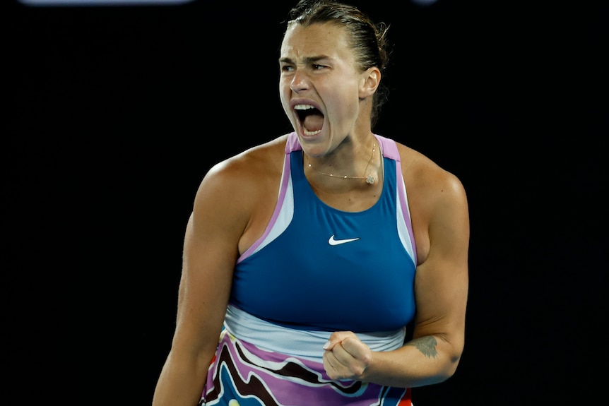 A tennis player yells.