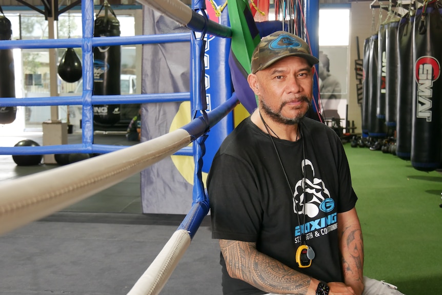 A man in a boxing gym.