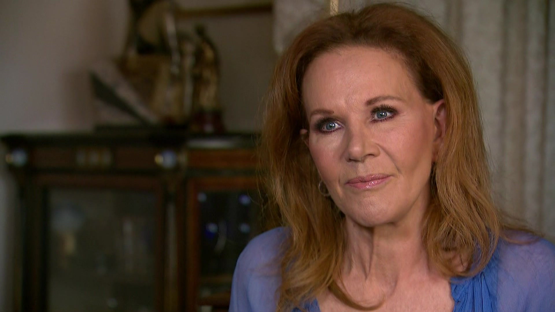 A lady in a blue dress 