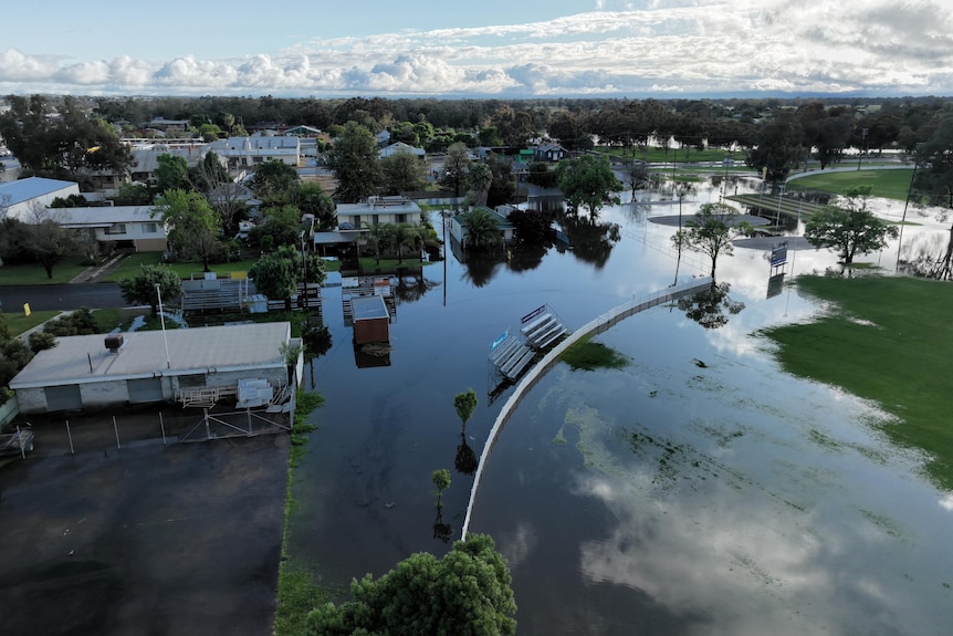 An aerial view of a flooded country town.