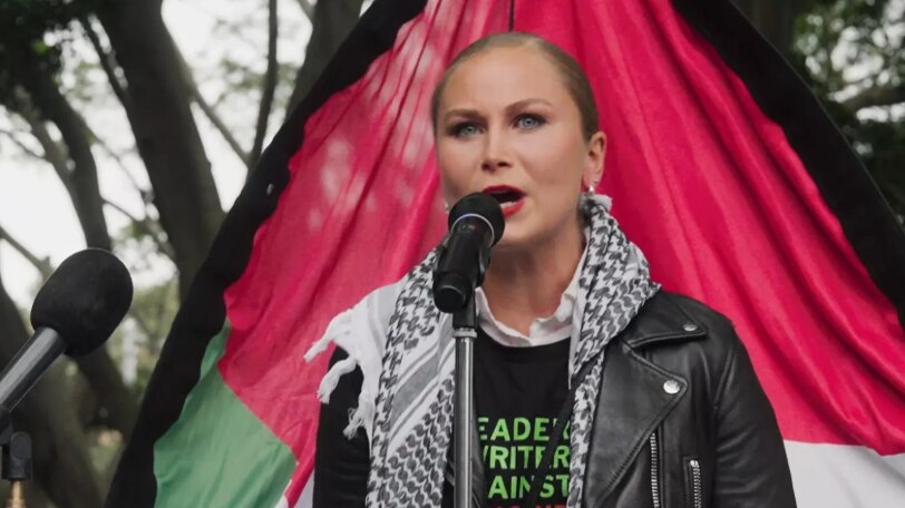A woman speaking into the mic