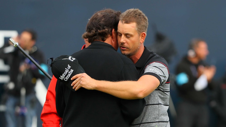 Henrik Stenson hugs Phil Mickelson after winning British Open