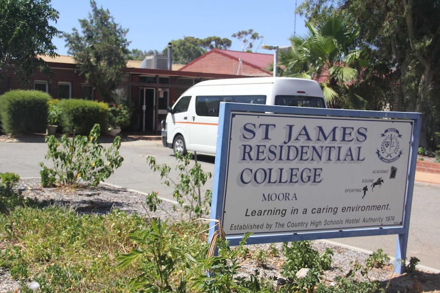 A sign marks the entrance for Moora Residential College, with a van, building and trees in the background.