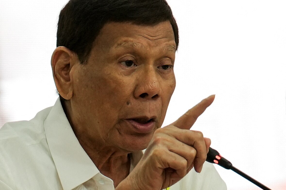 A close up picture of Rodrigo Duterte speaking into a microphone.