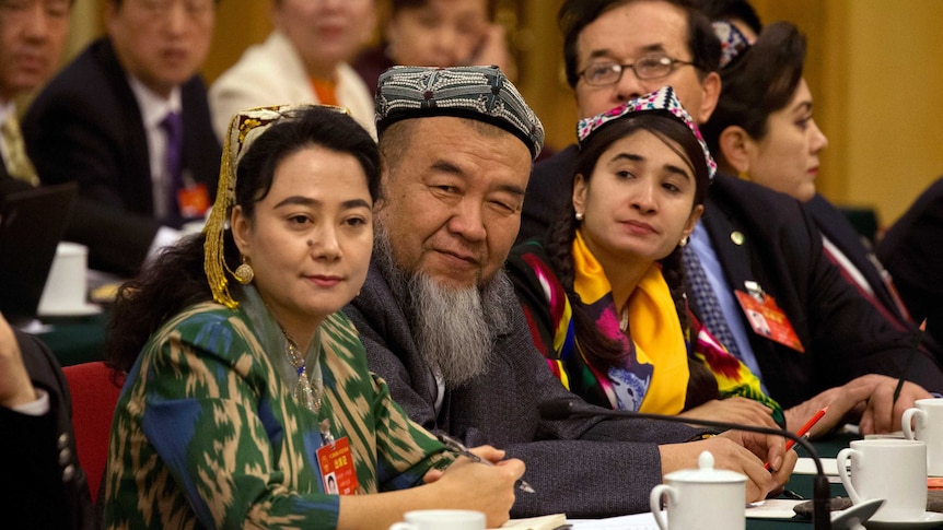 Delegates in meeting in traditional dress