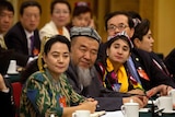 Delegates in meeting in traditional dress