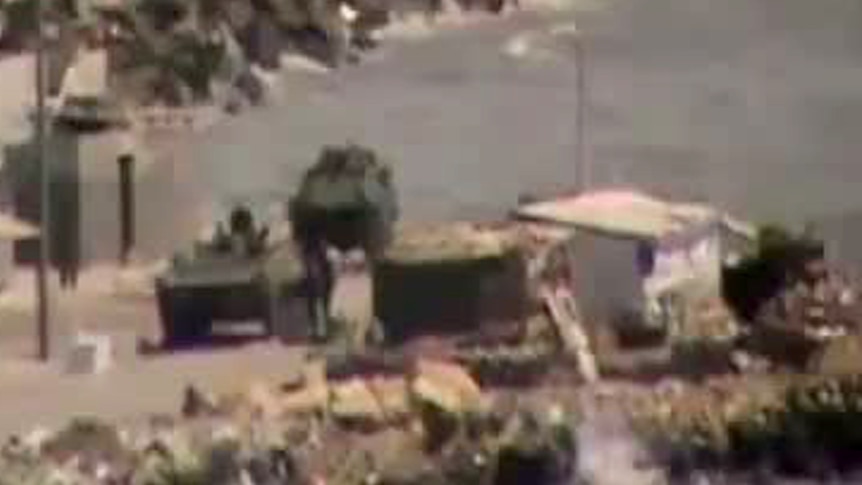 Tanks in Syrian port town