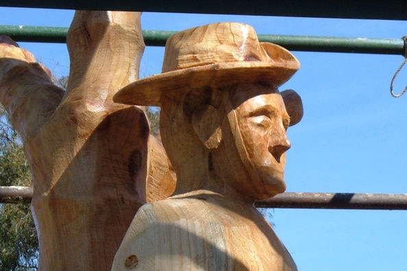 Timber statue memorial to Tasmanian POWs at Greens Beach, northern Tasmania.