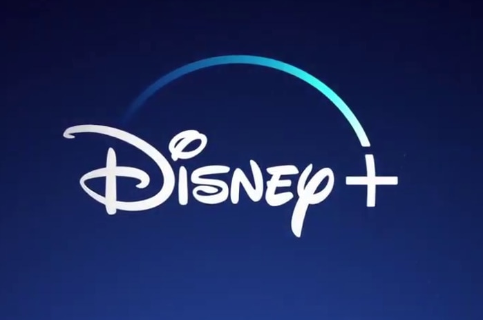 Белый журнал Disney Plus на темно-синем фоне.