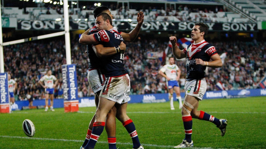 Roosters celebrate the try of Daniel Tupou