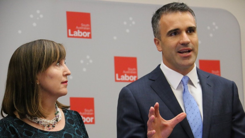 Susan Close stands next to Peter Malinauskas.