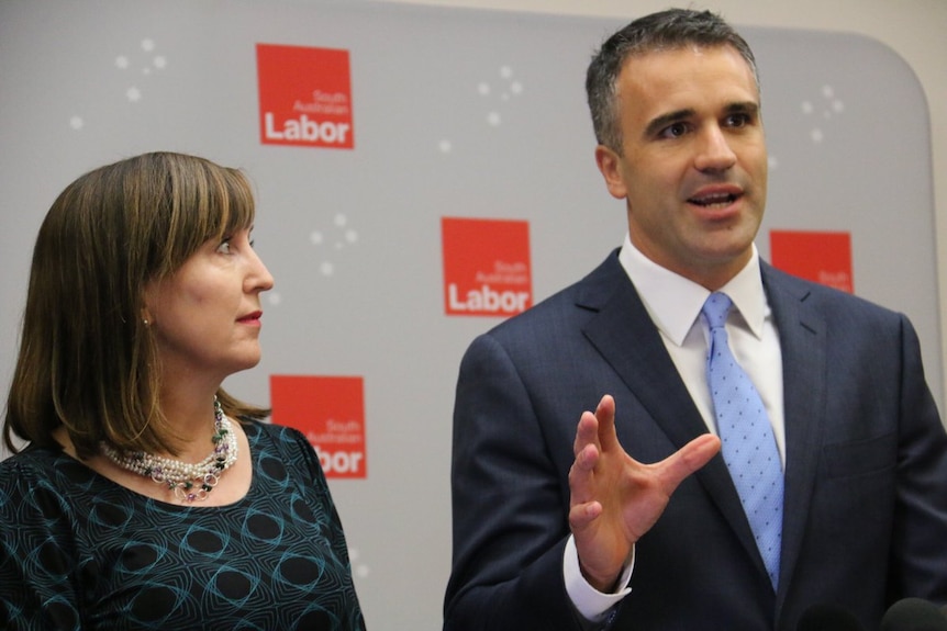 Susan Close stands next to Peter Malinauskas.