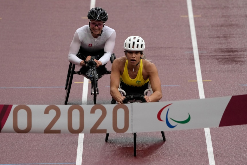 Paralympians crossing the line after competing in a marathon race