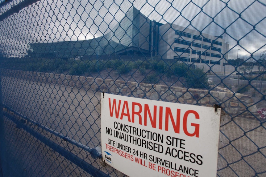 The site of the new ASIO headquarters has long been surrounded by construction fencing.