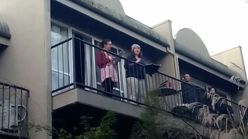 Lisette Bolton and Teresa Ingrilli singing opera from a balconry