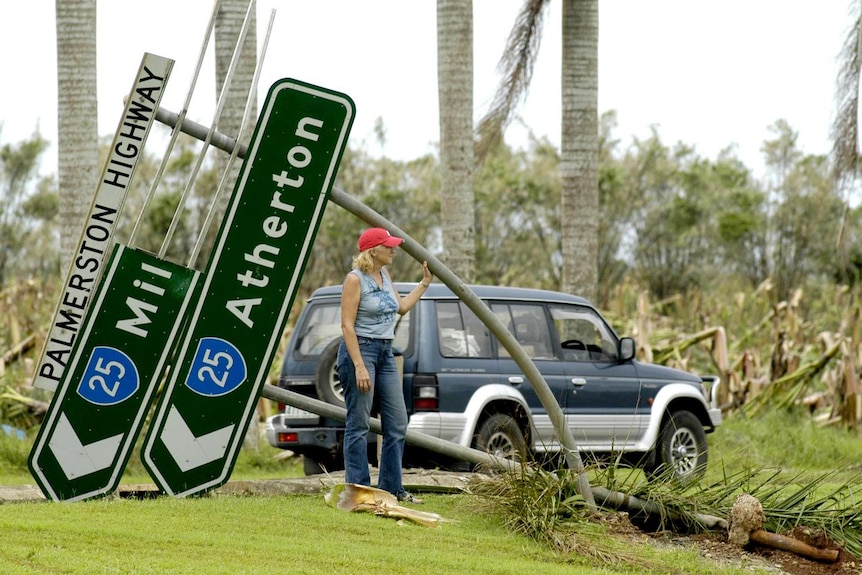 Anne Fitzpatrick surveys roadside damage in the wake of Cyclone Larry in Innisfail in 2006.