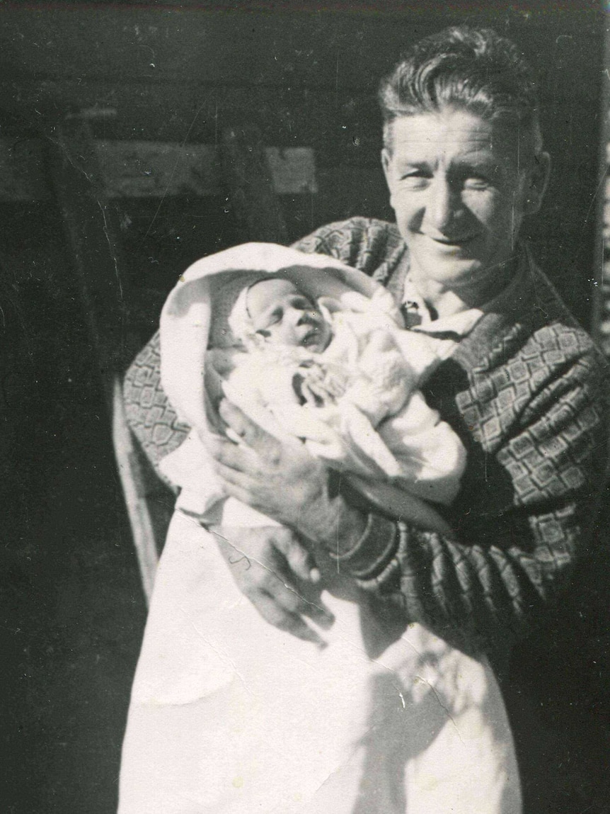 Man holding a baby in Launceston post WWI