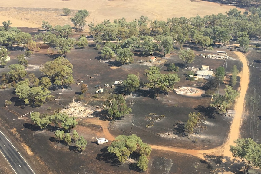 An aerial picture of burnt and collapsed buildings.