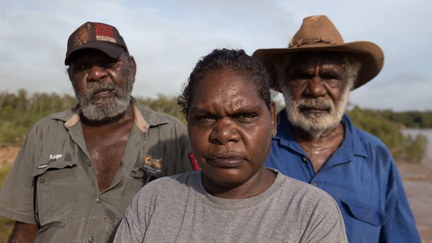 Casey Davey, Josie Davey Green and Jack Green stand and look at the camera in Borroloola.