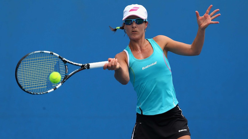 Spain's Nuria Llagostera Vives plays in a doubles match at the 2013 Australian Open.