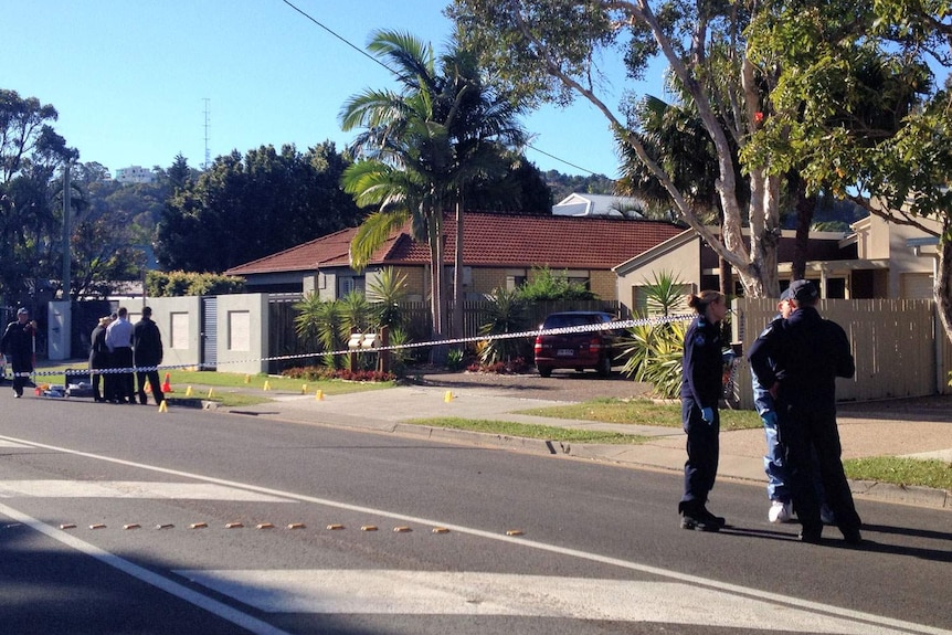 Forensic police outside crime scene at house at Coolum Beach