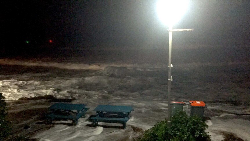 High tide with water around picnic tables at Yamba