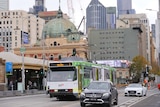 A few trams and cars on Princes Bridge, near Flinders St Station