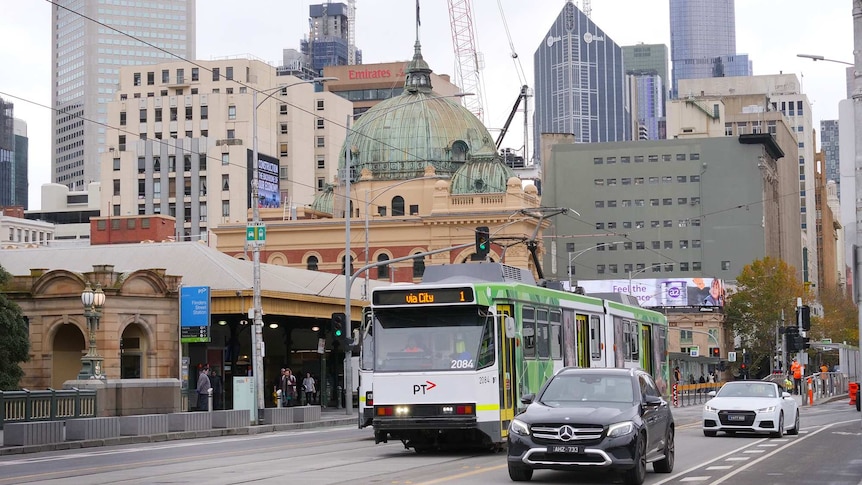 A few trams and cars on Princes Bridge, near Flinders St Station