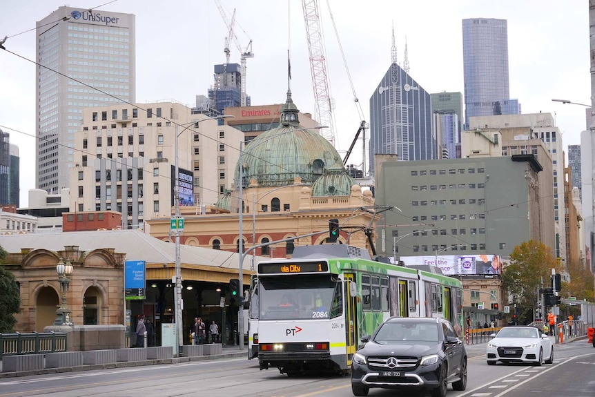 A few trams and cars on Princes Bridge, near Flinders St Station